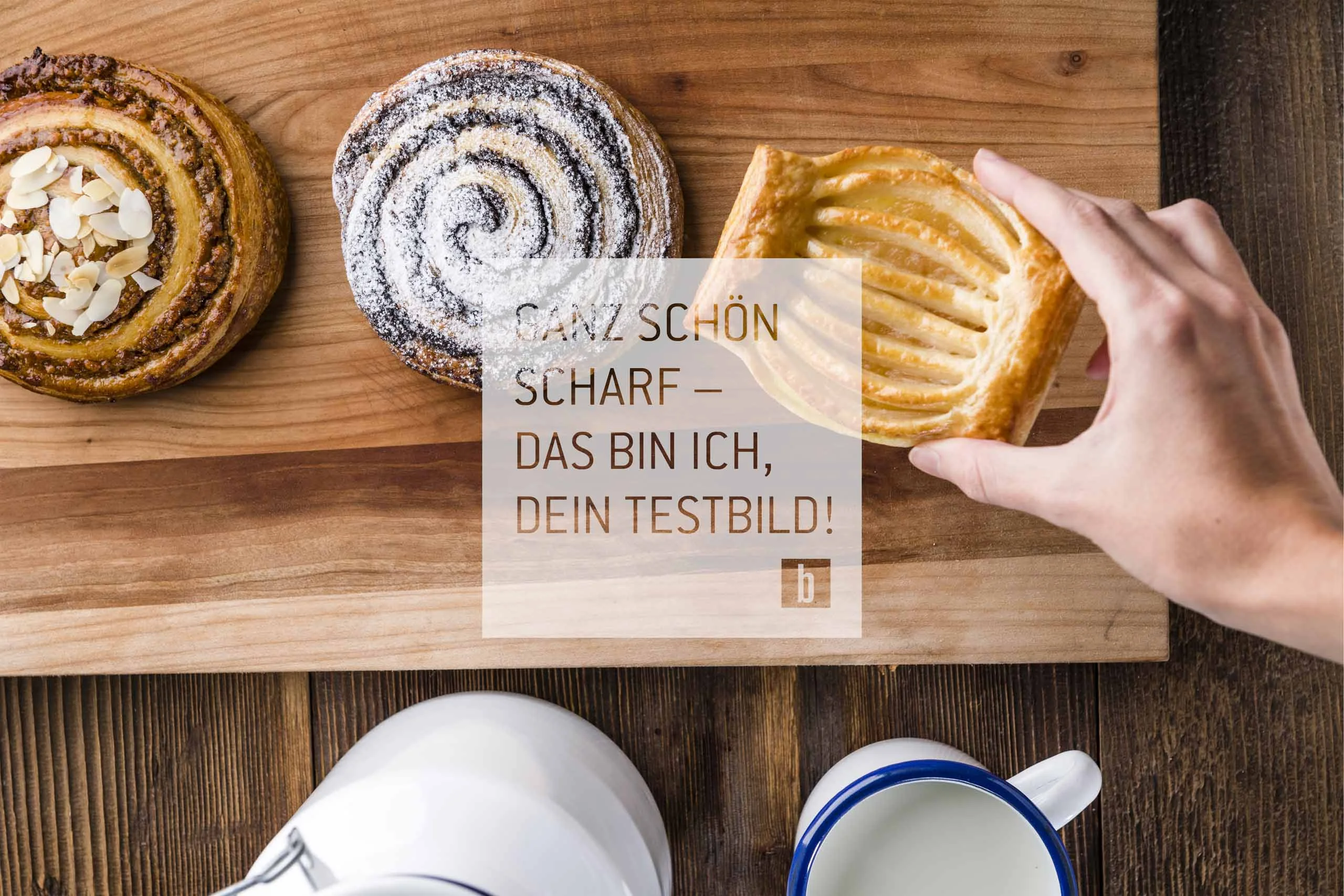 Hand picking pastry from wooden board with three different pastries